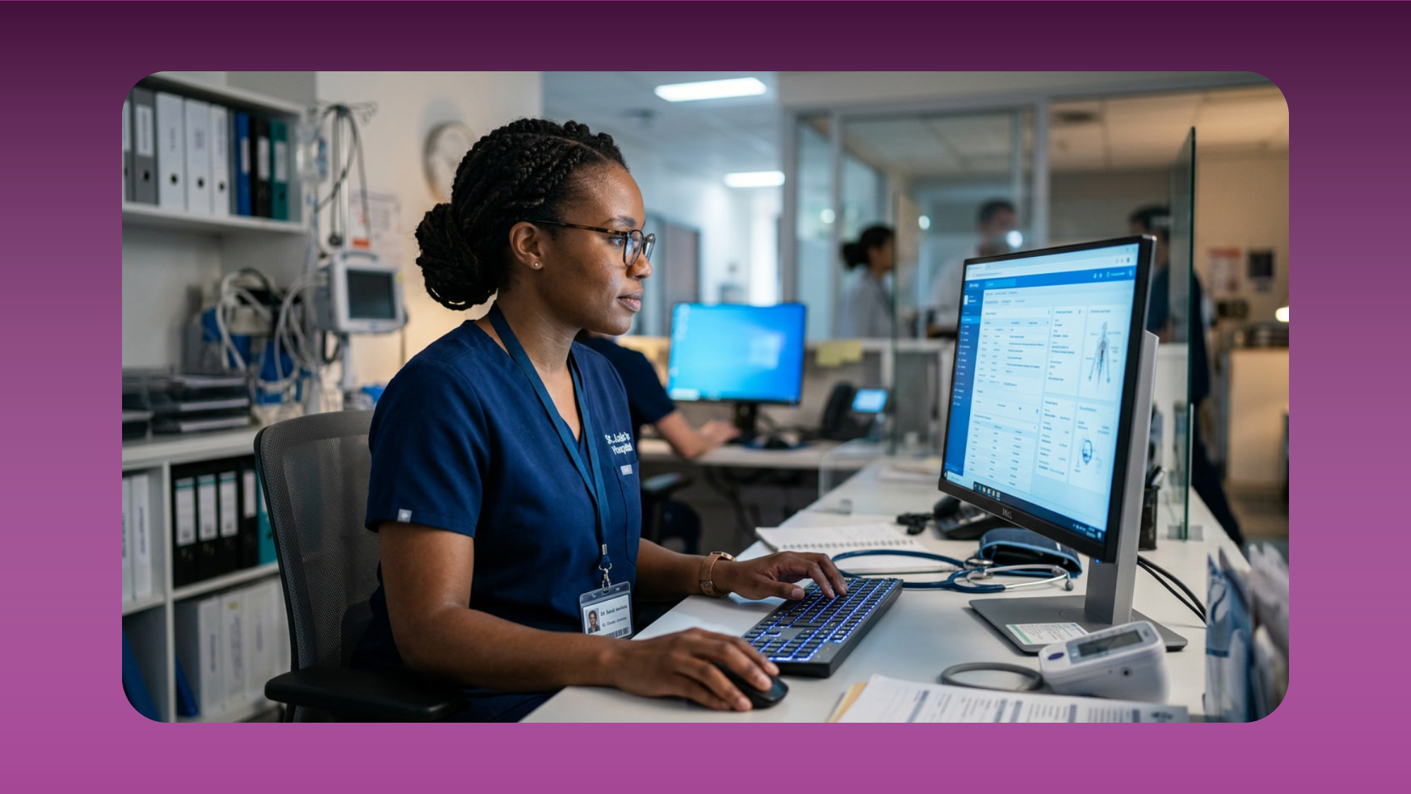 A healthcare professional in scrubs uses a clinical software dashboard at a hospital workstation, representing how headless Knack connects custom frontends to a compliant backend data layer.