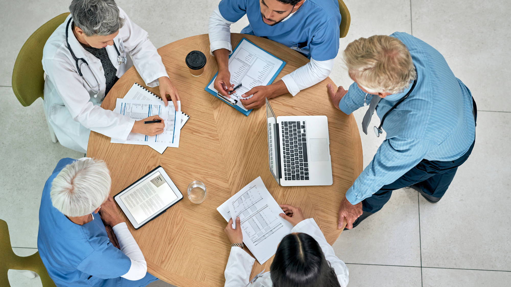 Healthcare team using no-code healthcare CRM software to review patient records and referral data