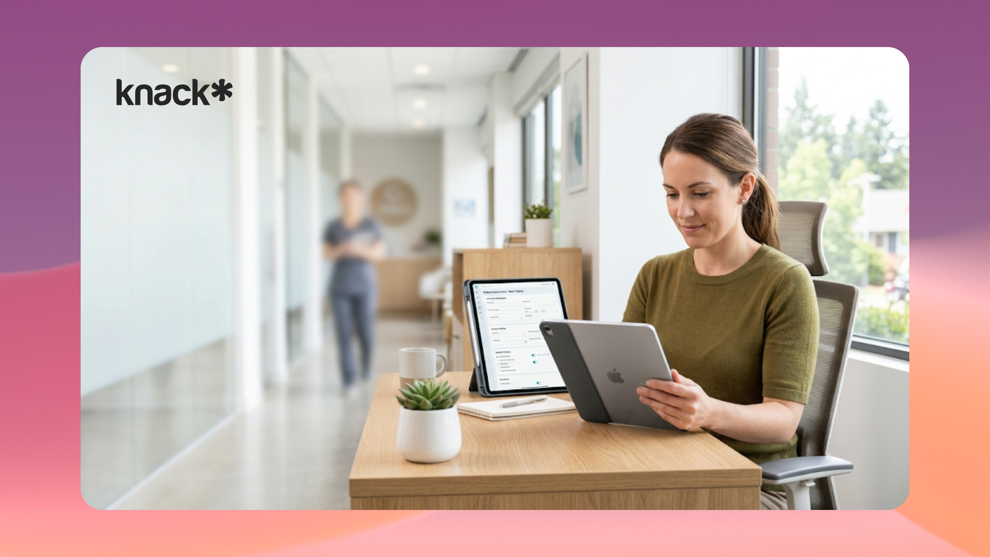 Healthcare clinic administrator reviewing a custom patient portal software intake form on a tablet